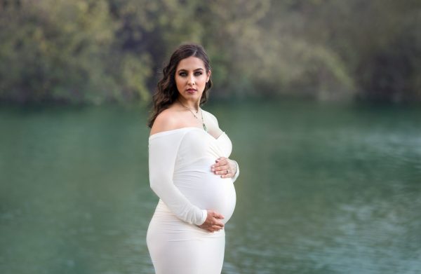 Rent this long sleeve, off the shoulder gown for your maternity photo shoot or special occassion