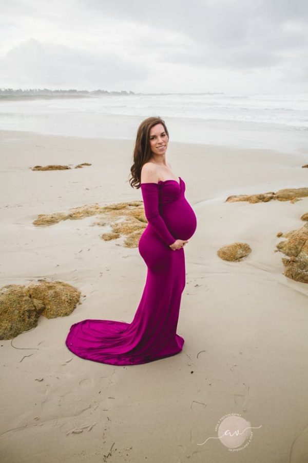 Purple maternity dress rental photoshoot at the beach.