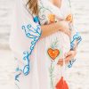 Rent this unique embroidered dress for an maternity special event
