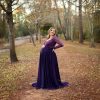 Eggplant purple colored longlseeve maternity dress photoshoot in the woods