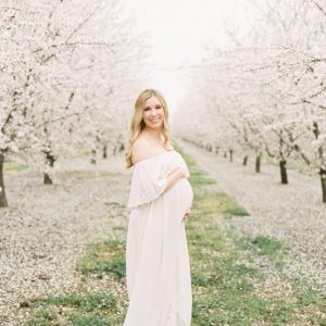 white dress maternity photoshoot idea in a fall setting